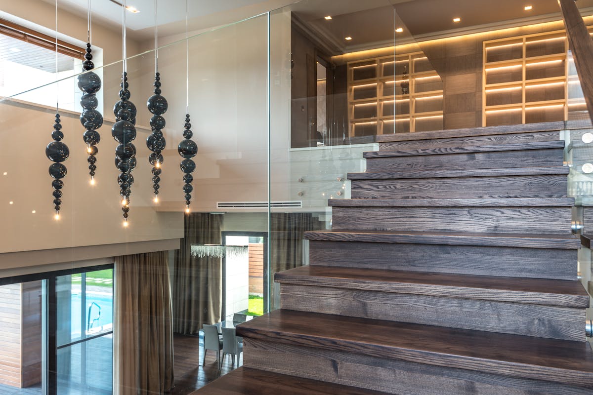 Elegant interior with pendant lighting and timber staircase