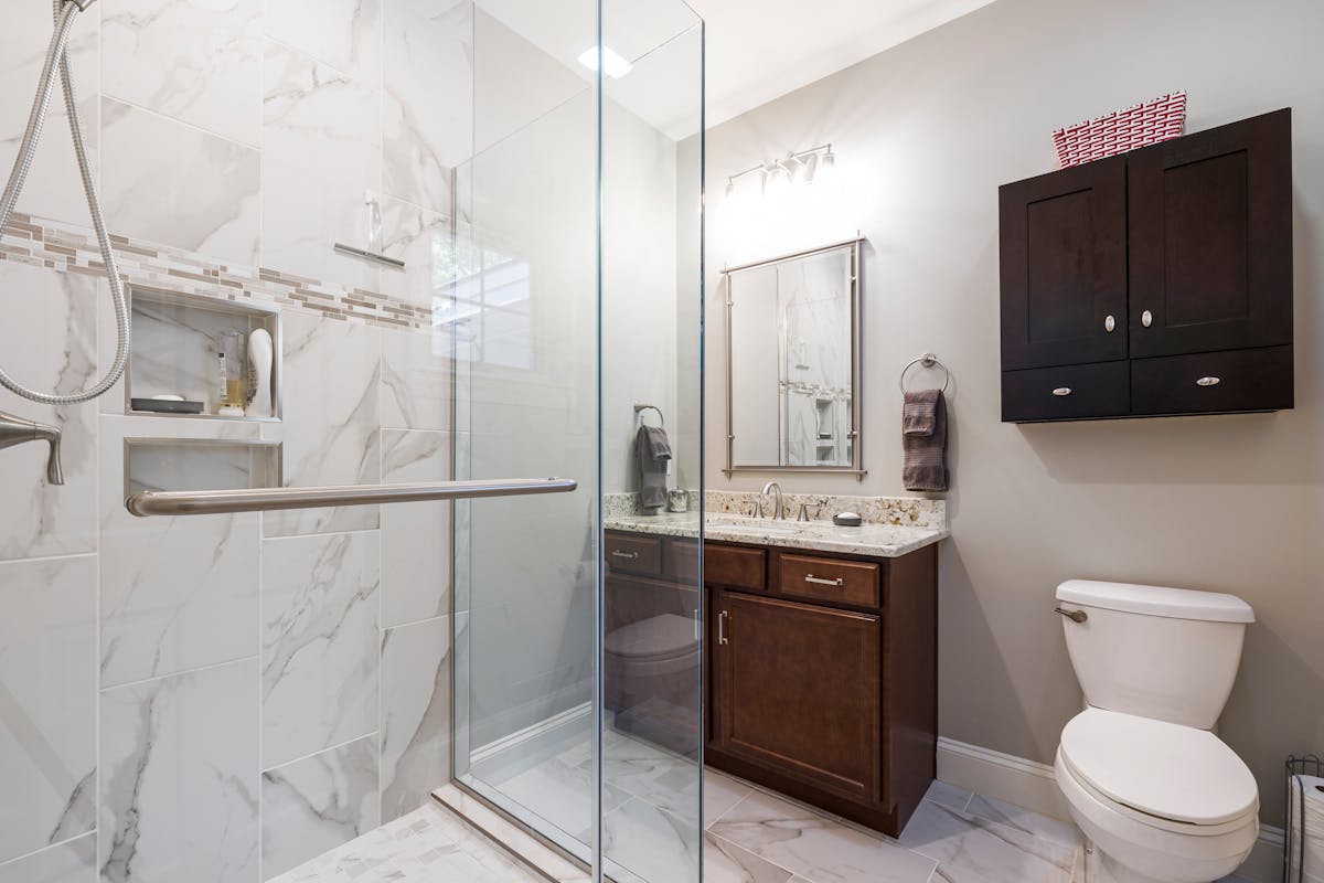 Modern bathroom with marble shower and elegant fixtures